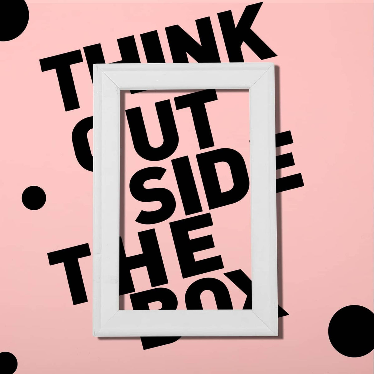 Bold black vinyl letter stickers inside a white frame on a pink background
