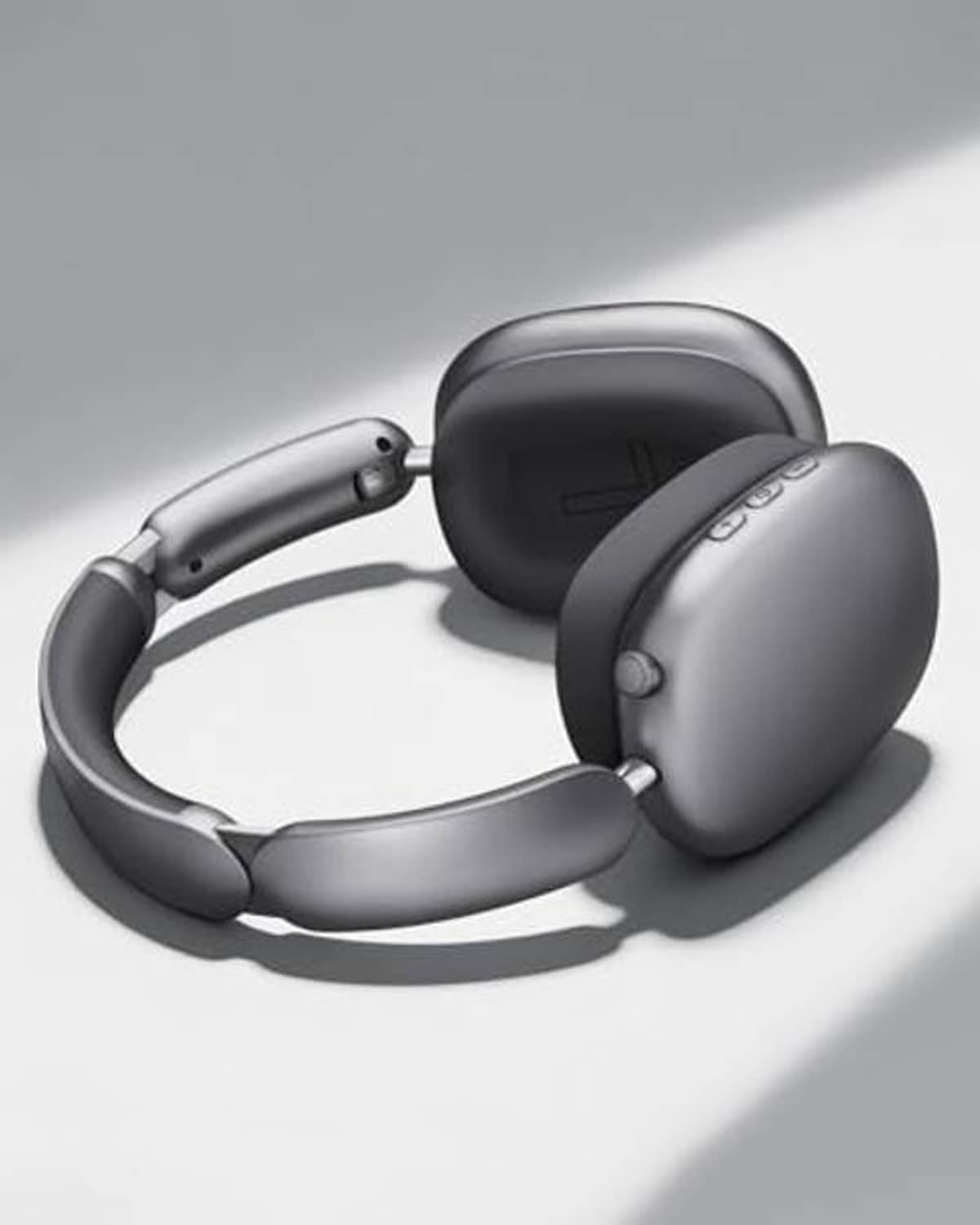 Over-ear wireless headphones in grey and black, angled view with ear cups and headband