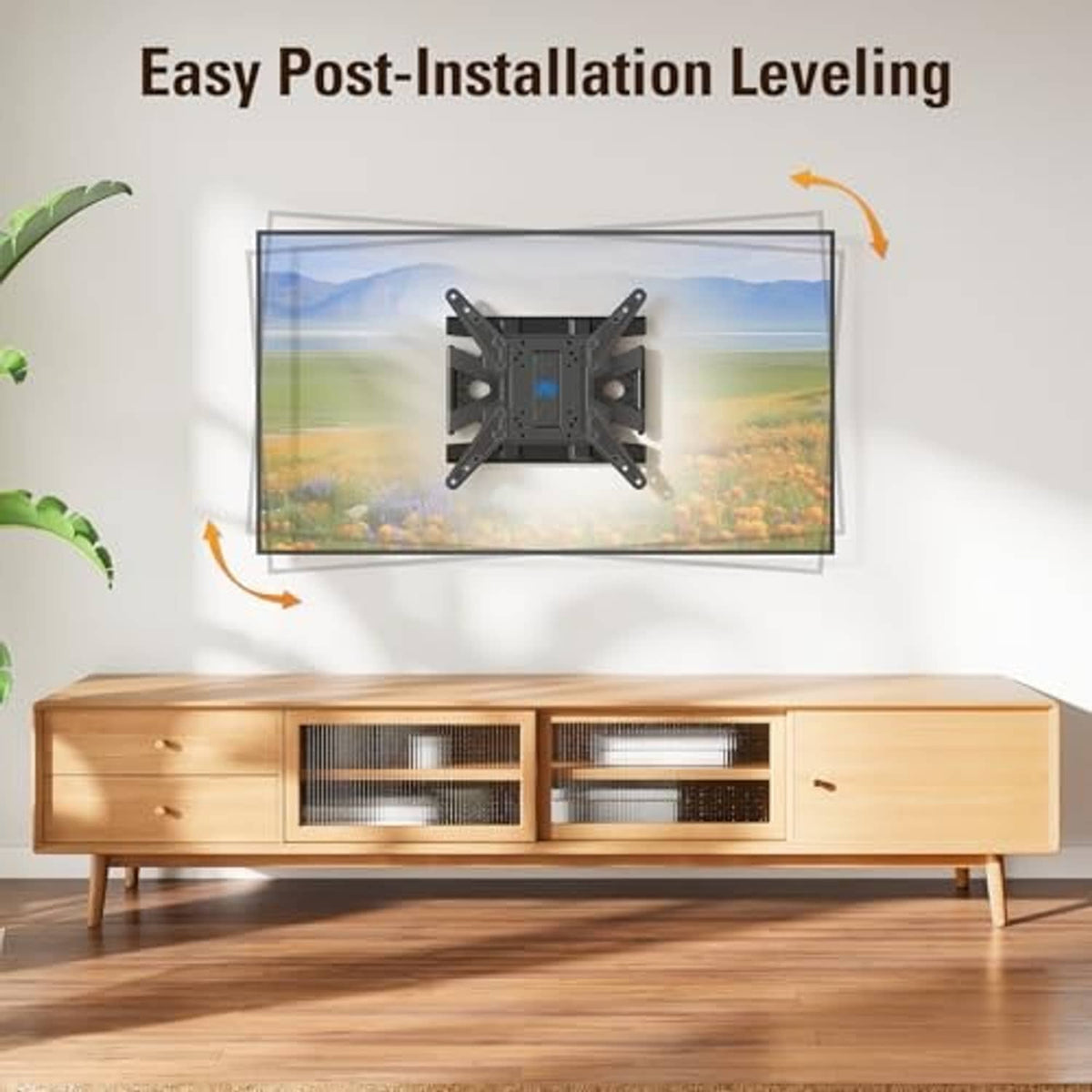 Black TV wall mount bracket with leveling adjustment shown under TV mount plate