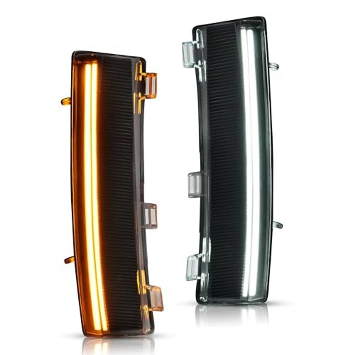 Pair turn signal lights with clear lens and black housings, left amber-lit