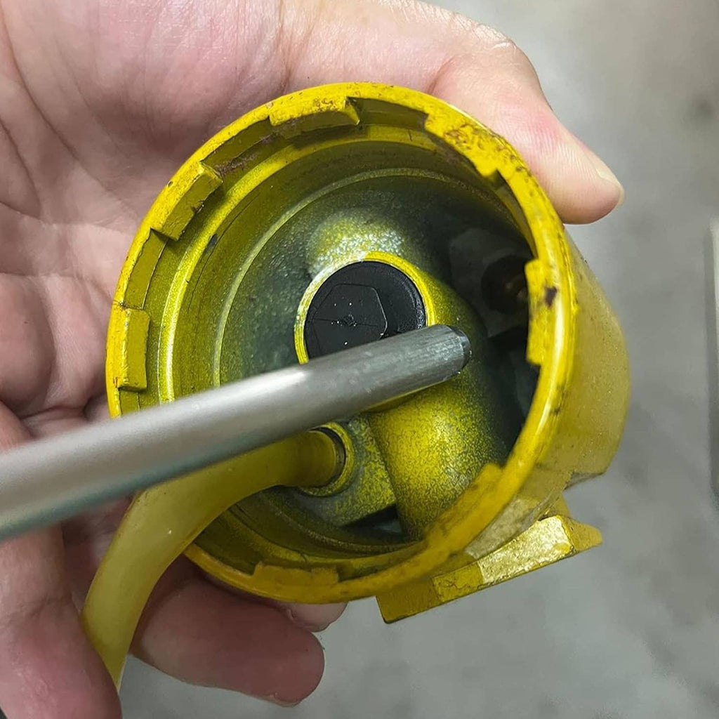 Sandblaster nozzle tip and internal insert shown in a yellow housing