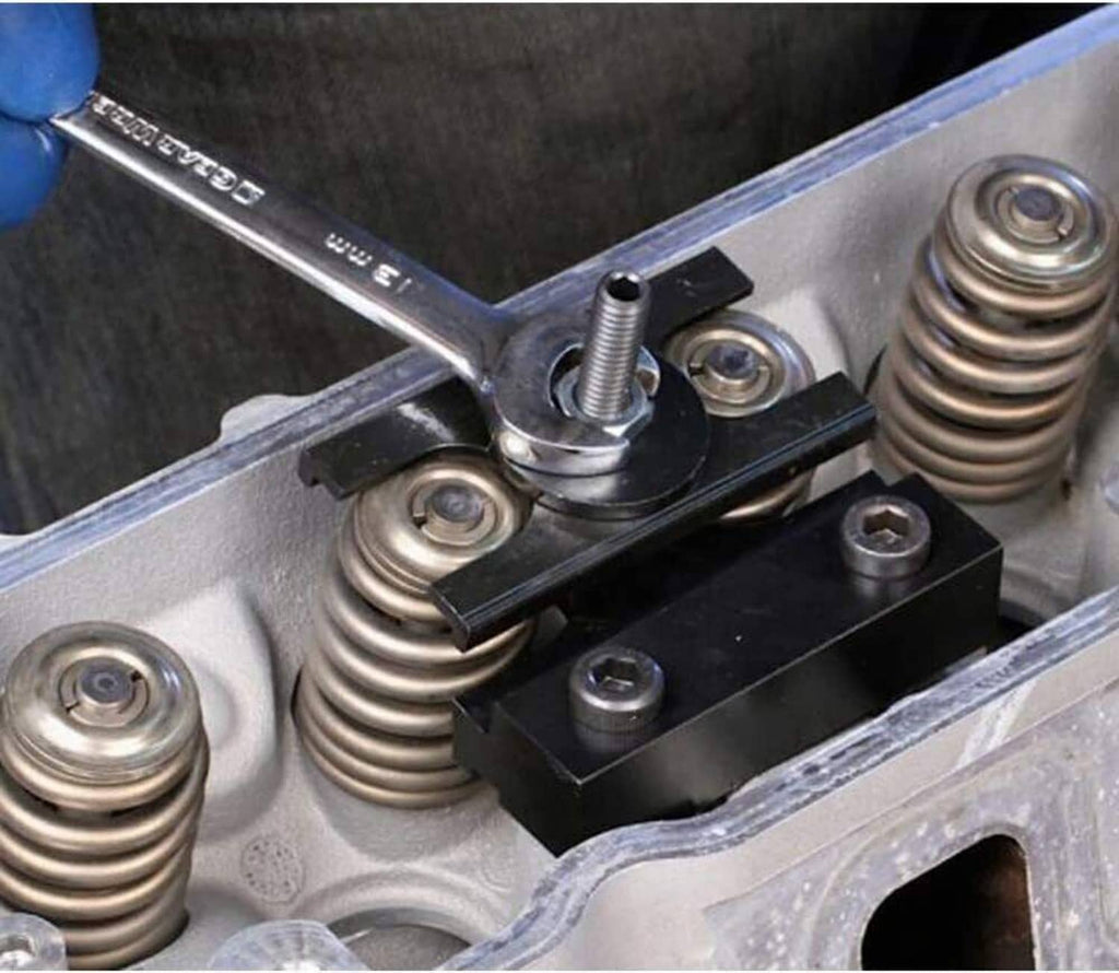 Valve spring compressor tool installed over valve springs with threaded push rod