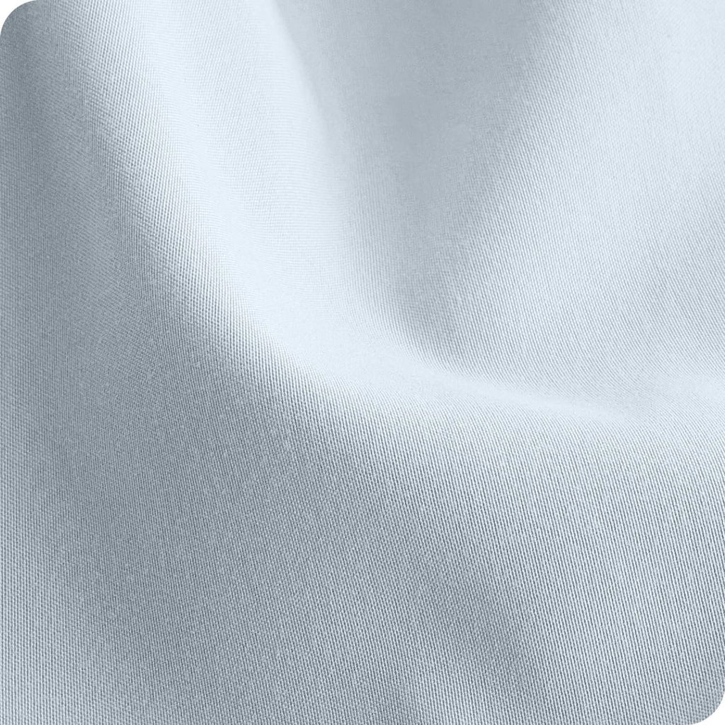 Light sky blue microfiber fitted sheet fabric close-up, fine woven texture