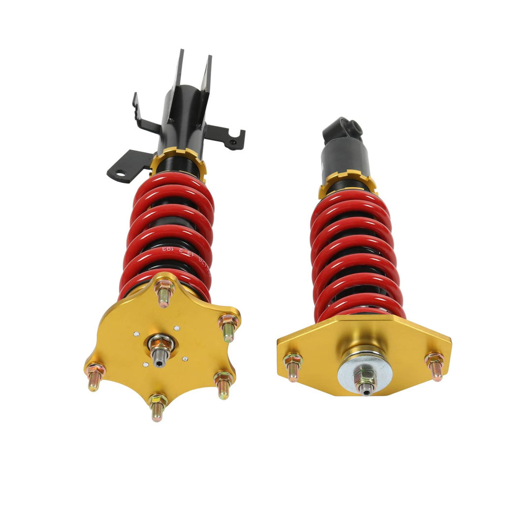 Two coilover shocks with red springs and gold spring seats, black top mounts