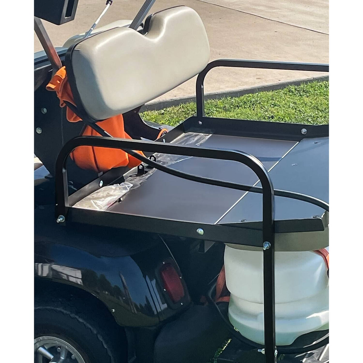 Golf cart rear flip seat kit close-up showing gray backrest and black mounting frame
