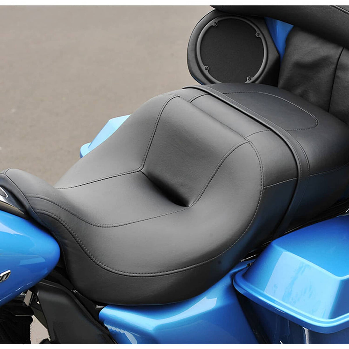 Black 2-up motorcycle seat with padded backrest hump and double-stitched contour lines