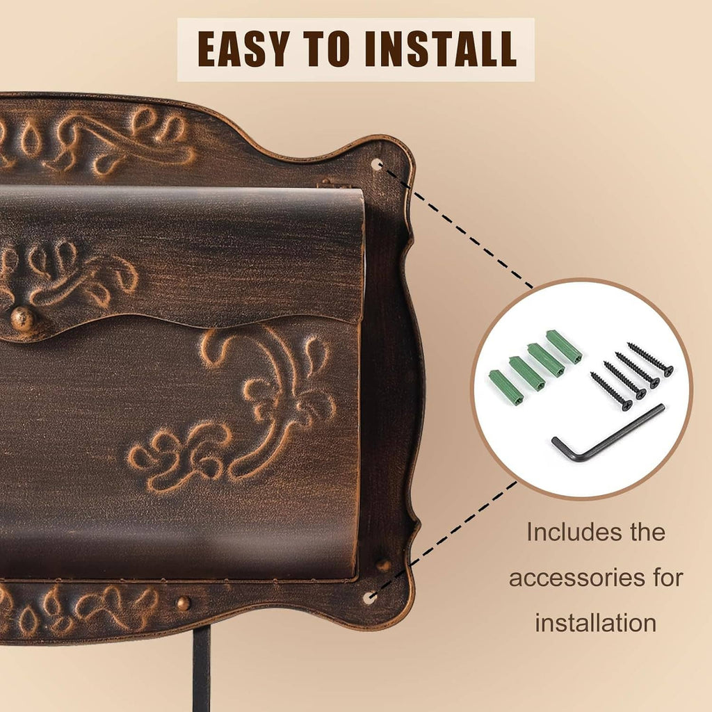 Embossed dark bronze wall mailbox front with decorative floral panel and mounting pegs