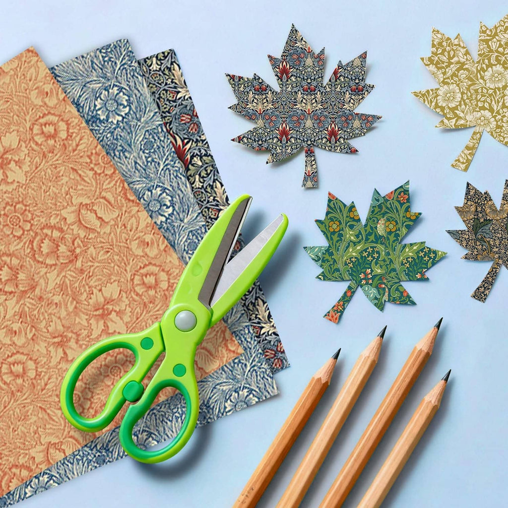 Classical floral scrapbook paper sheets in orange, blue, and green with cutout shapes.