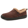 Tan suede bootie slippers with plush sherpa cuff and black rubber sole.