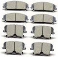Set of 8 gray ceramic brake pads with metal backing and curved edge clips