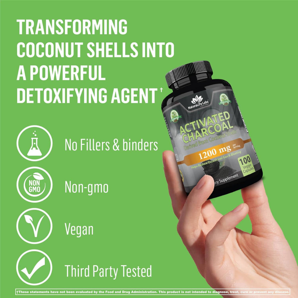 Activated charcoal capsules bottle held in hand, 1200 mg per serving