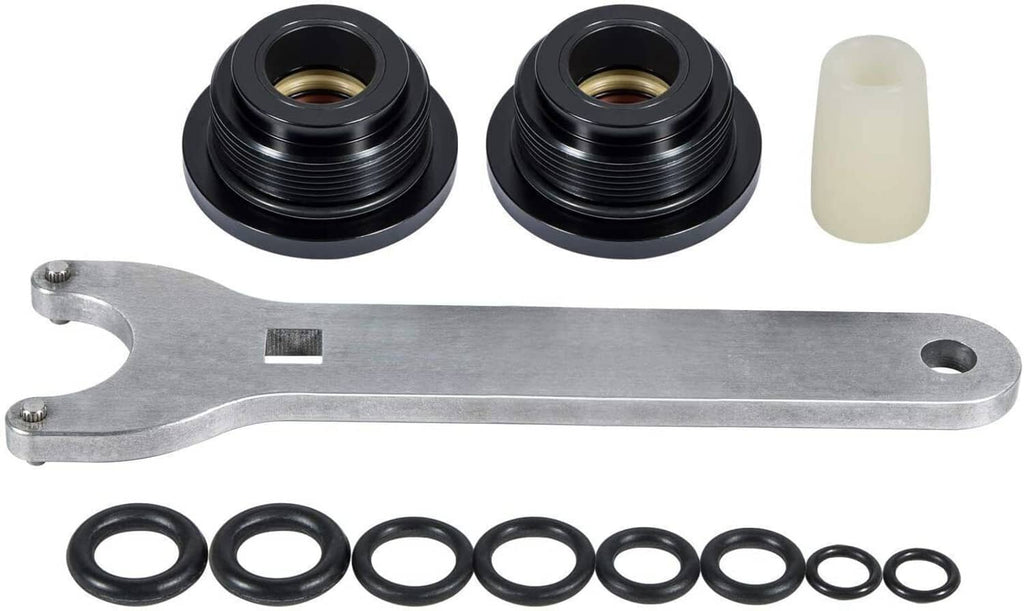Hydraulic steering seal kit with two black flanges, silver tool, and black O-rings