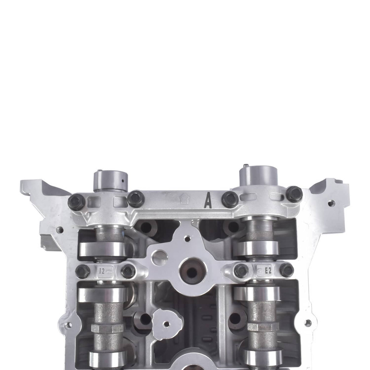 Cylinder head close-up with cam caps, lifter bores, and machined valve channels.