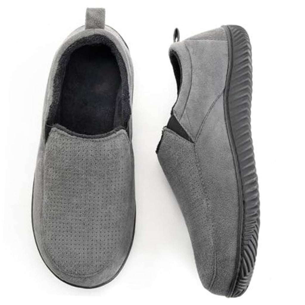 Charcoal pair of closed-back slip-on slippers with plush lining and cushioned sole.