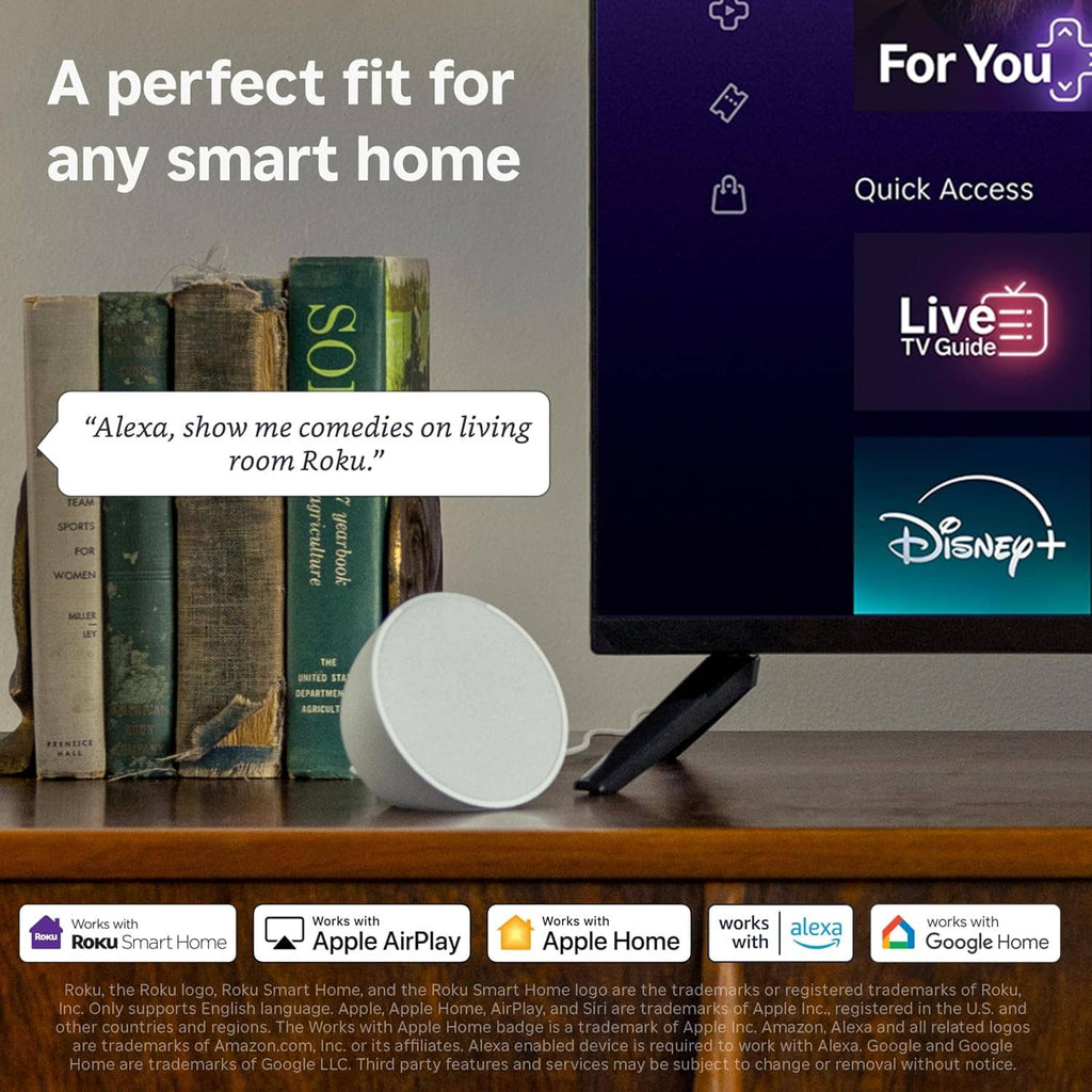 White streaming stick and black voice remote on tabletop