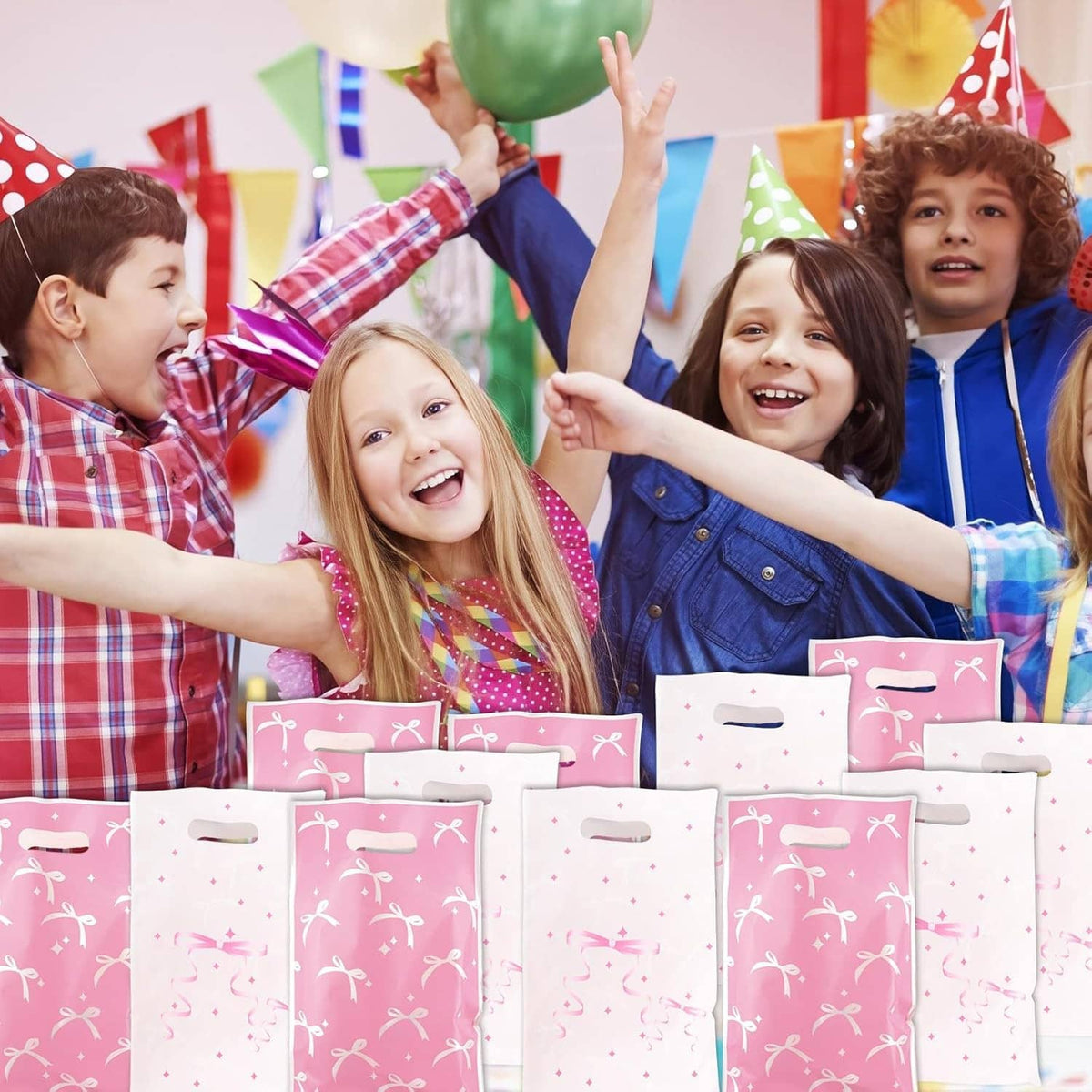 Kids holding pink and white bow-pattern gift bags with top handles