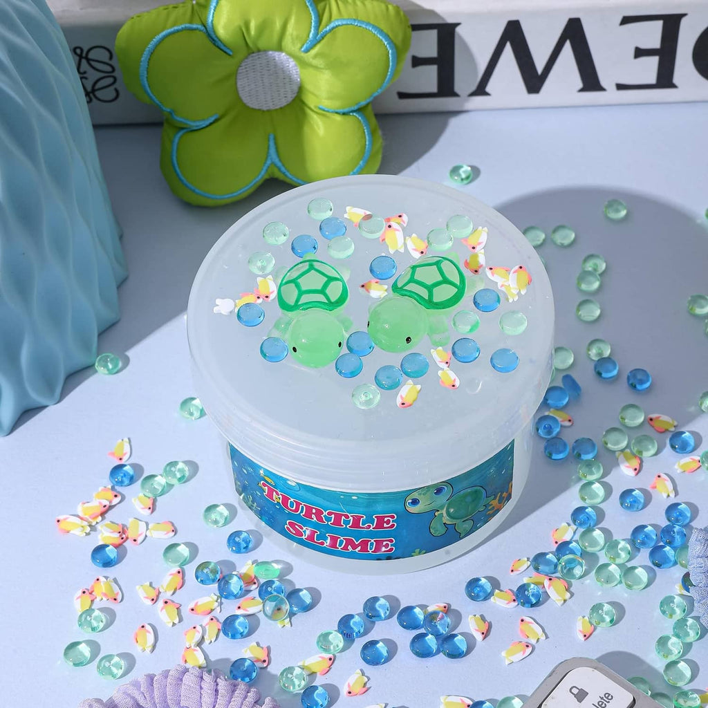 Clear blue turtle slime jar with colorful sprinkles and turtle-shaped charms