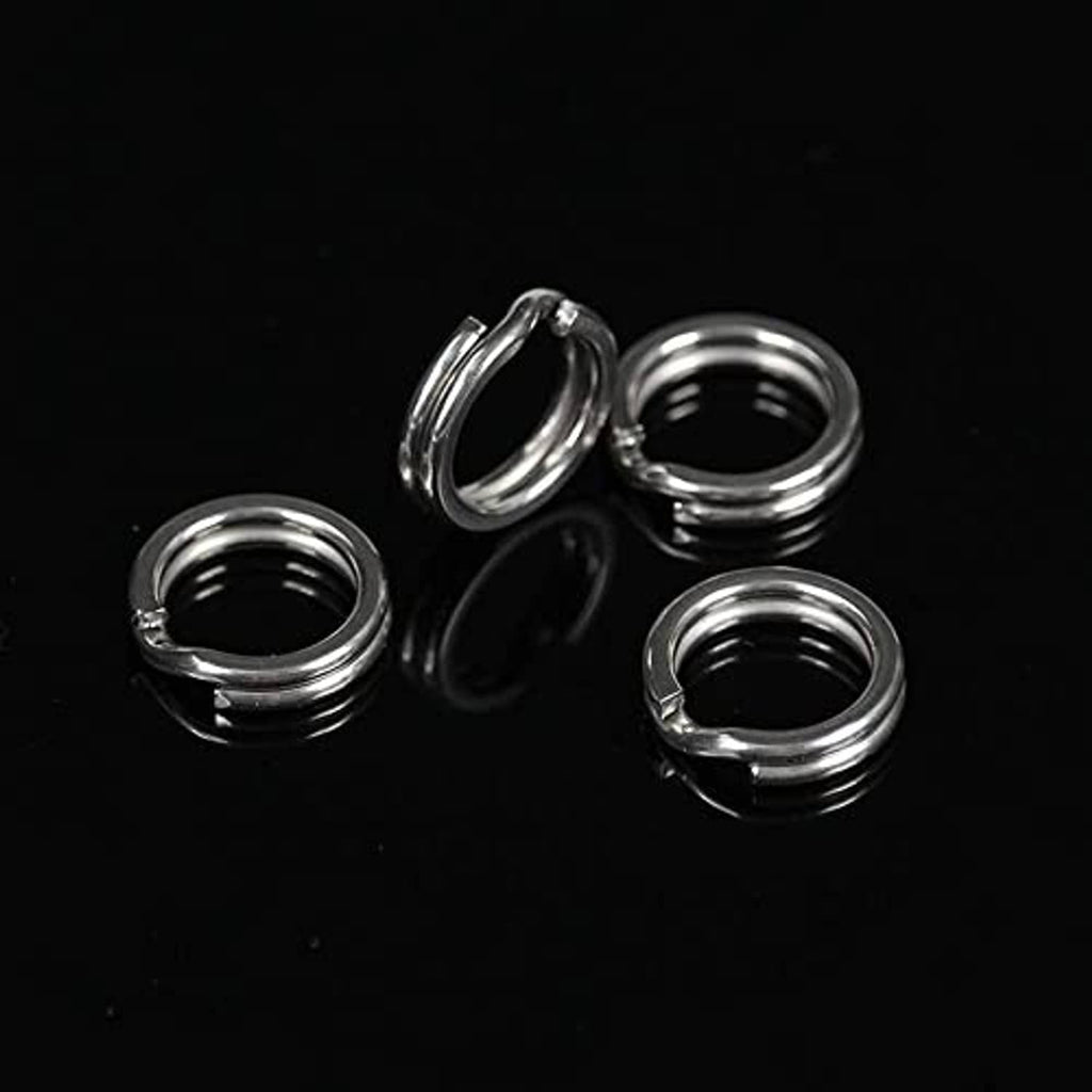Close-up of shiny stainless steel split rings, several sizes shown