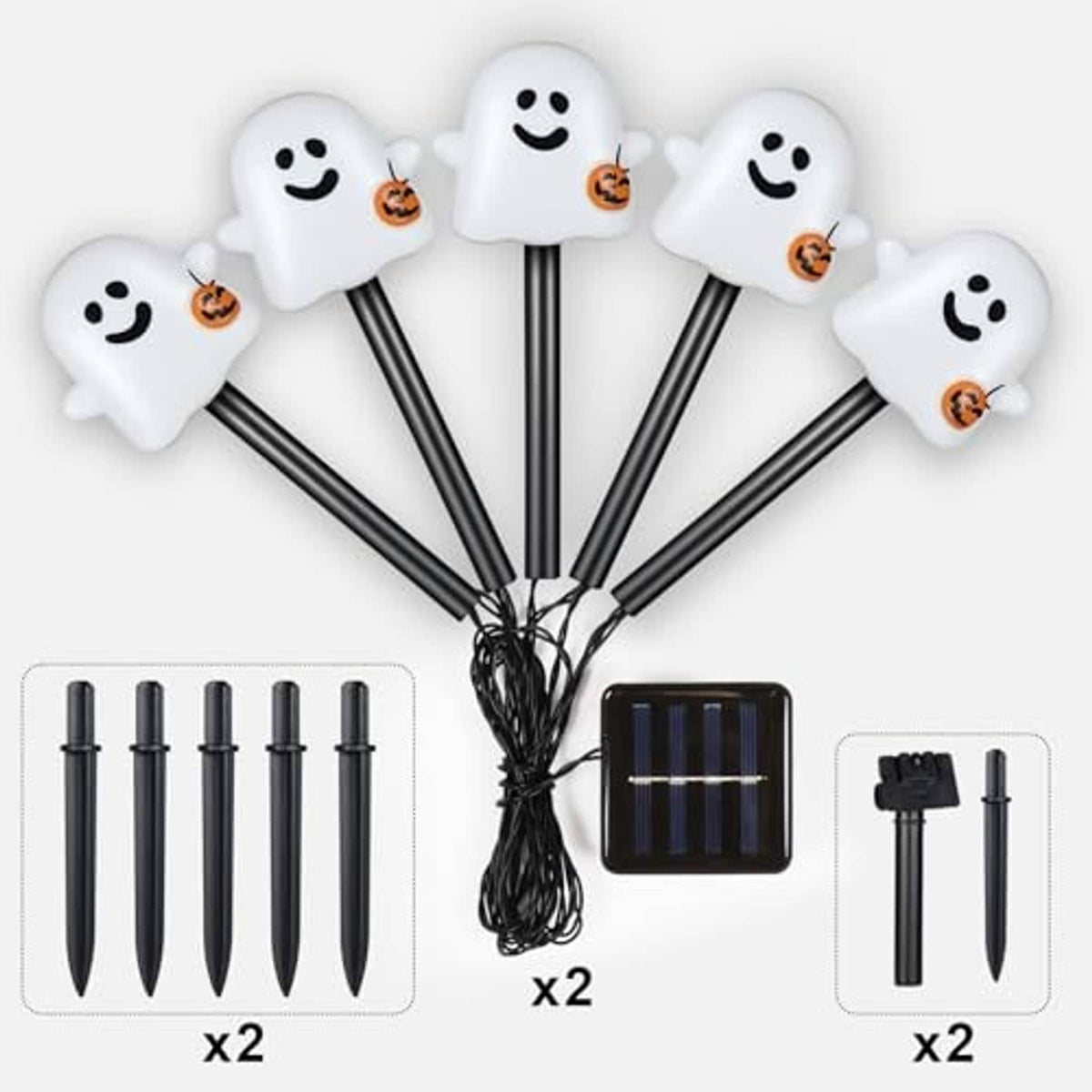 White smiling ghost solar pathway lights on stakes, with solar panel and bundled wire