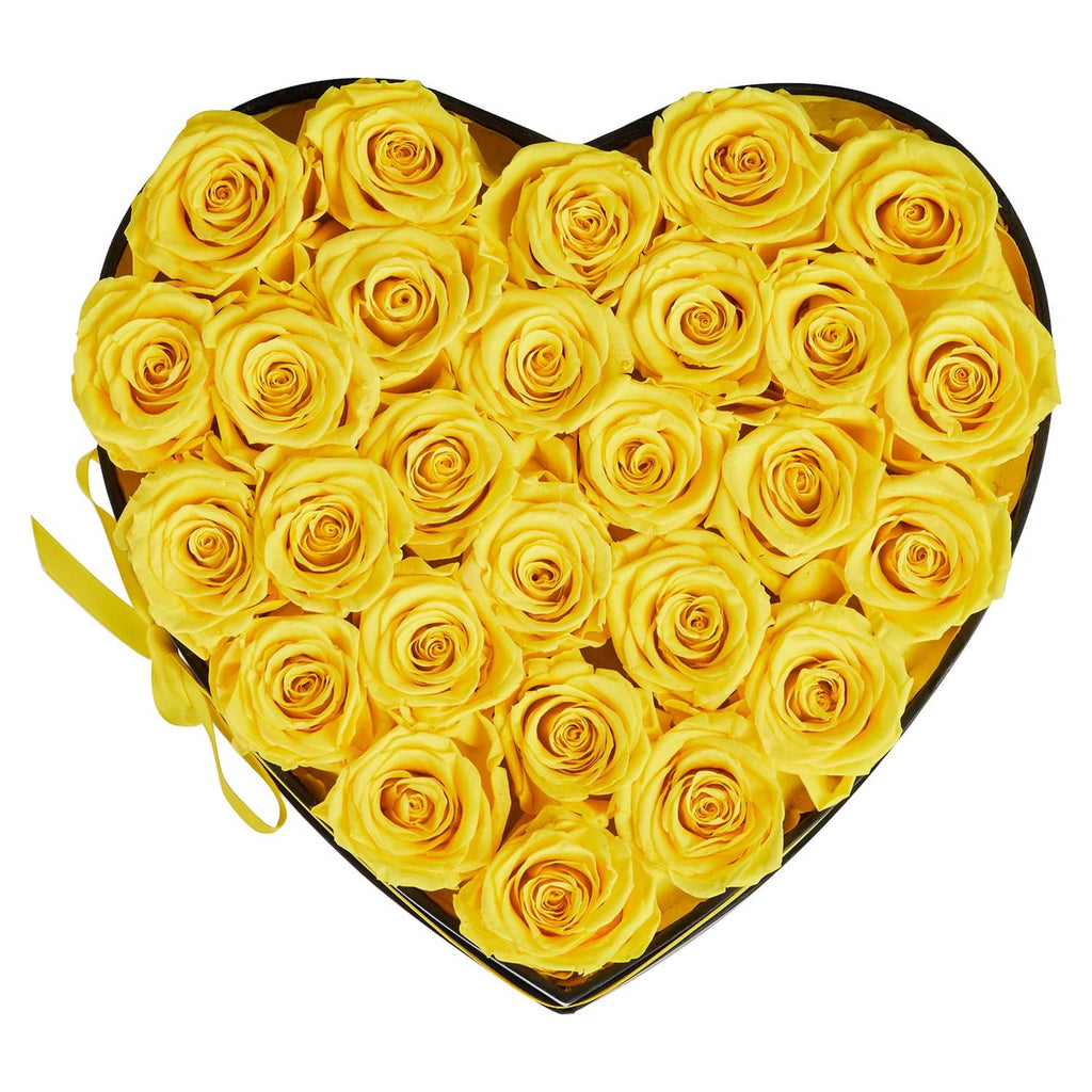 Heart-shaped black gift box of yellow preserved roses with ribbon edge