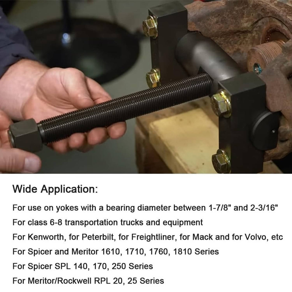 Hand holding yoke puller forcing screw with black pull bar for axle yoke