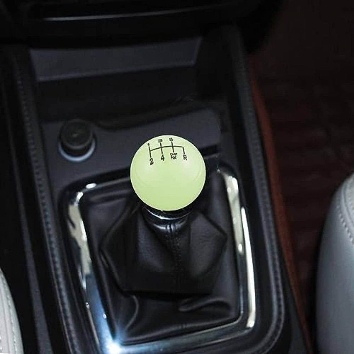 Fluorescent green gear shift knob installed on a manual shifter with numbered pattern