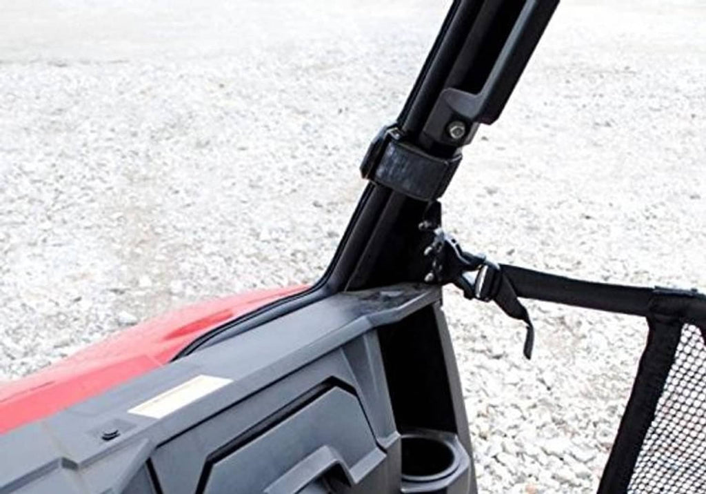 Close-up of black windshield mounting bracket on red UTV cab