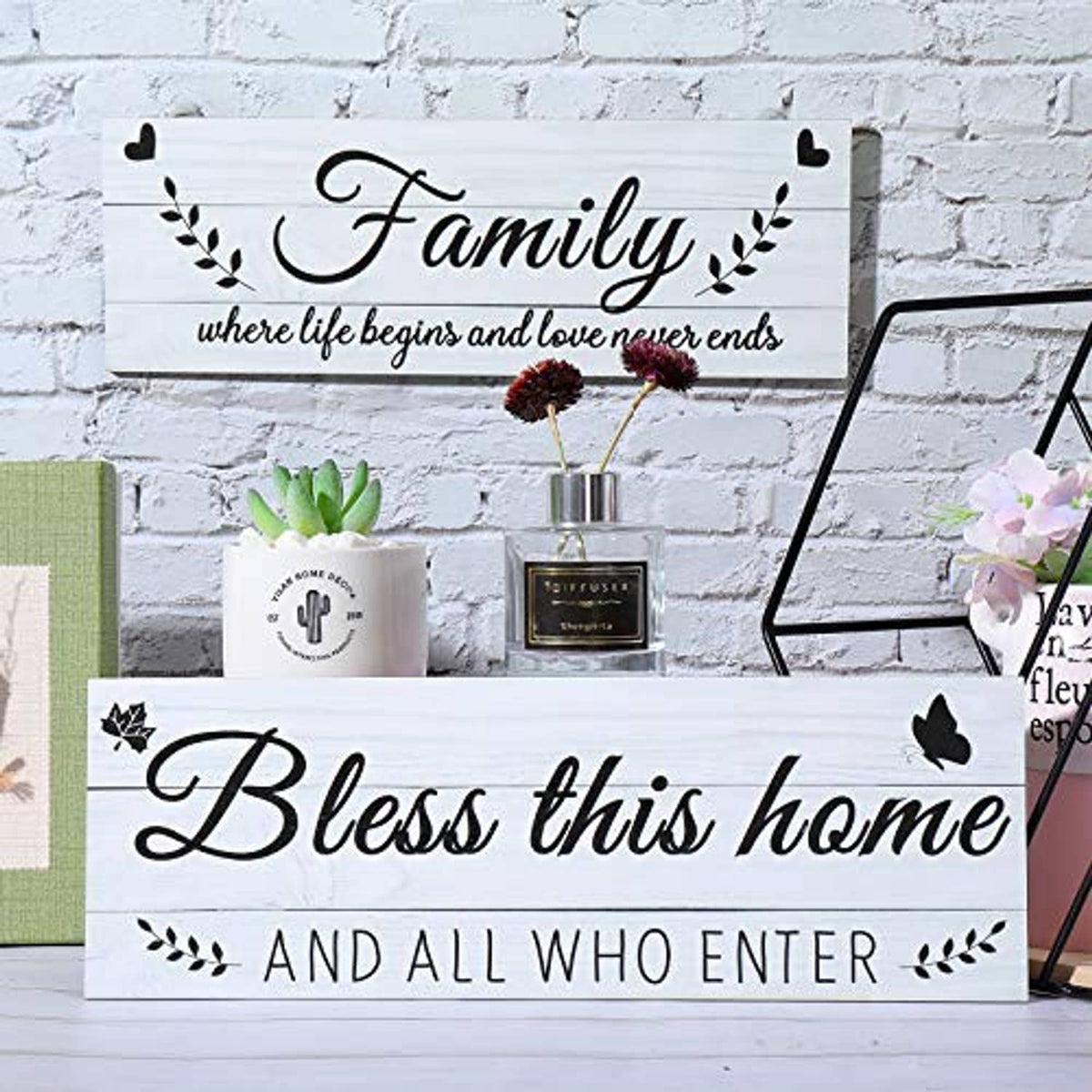 Two rustic wooden wall signs: “Family” and “Bless this home” with butterfly accents