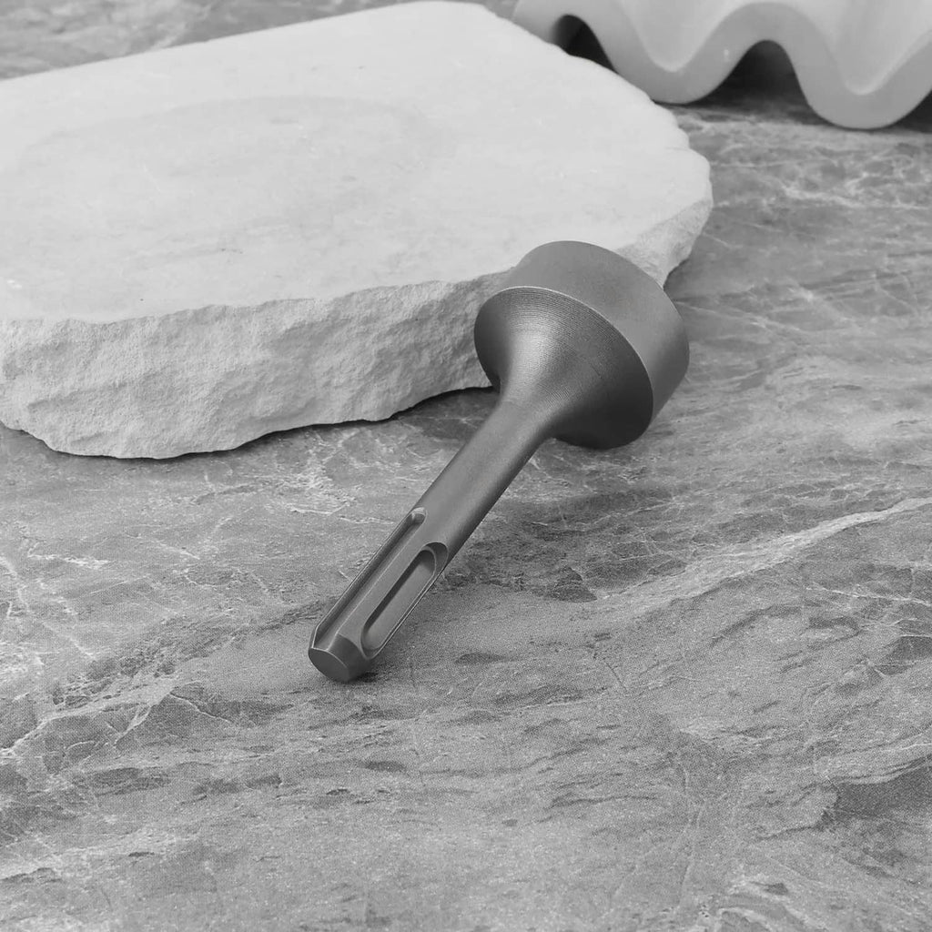 Grey ground rod driver adapter striking a rock surface