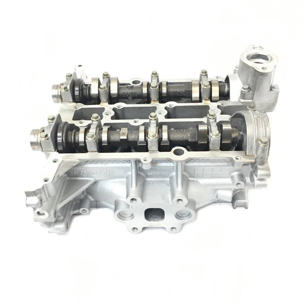 Cylinder head assembly with valvetrain components and side mounting ports