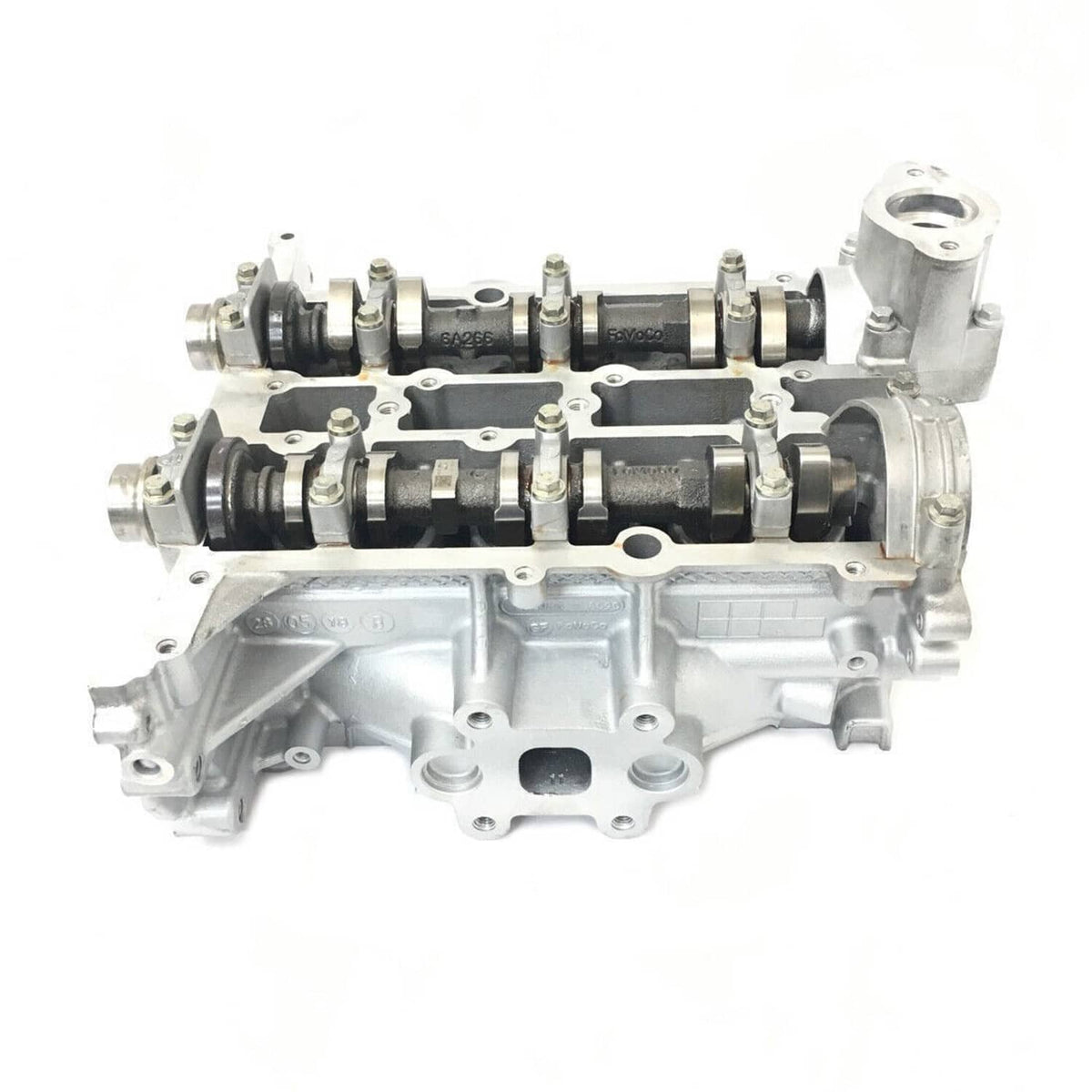 Cylinder head assembly with valvetrain components and side mounting ports
