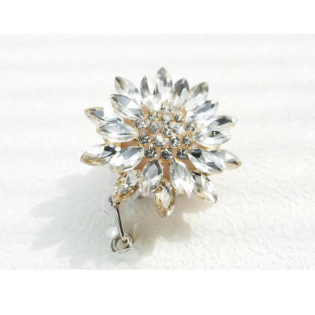 Crystal flower badge reel with silver metal clasp and hanging loop
