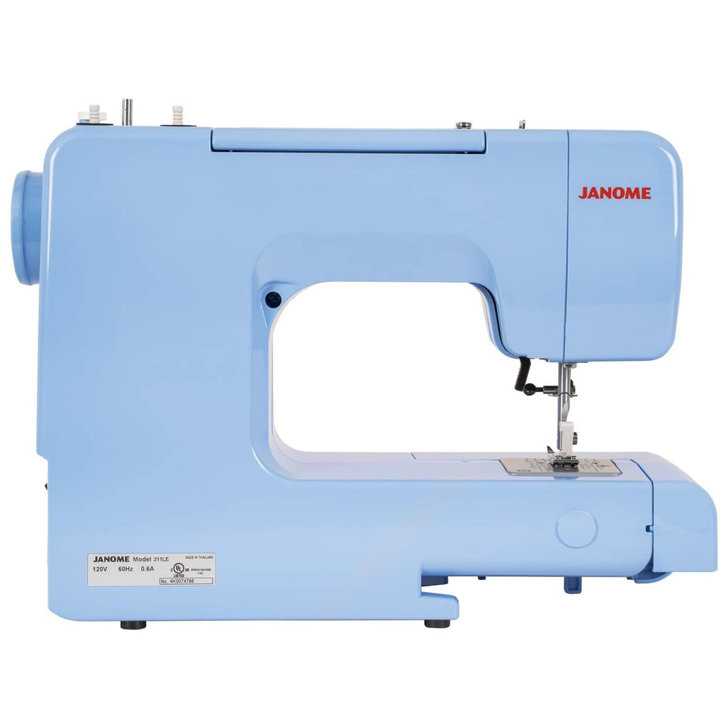 Blue Janome sewing machine side view with open arm and needle bar