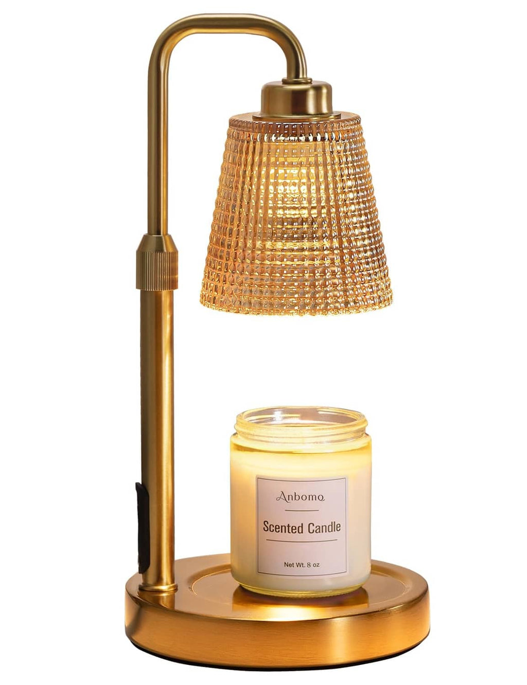 Gold candle warmer lamp with amber glass shade and scented jar candle on base
