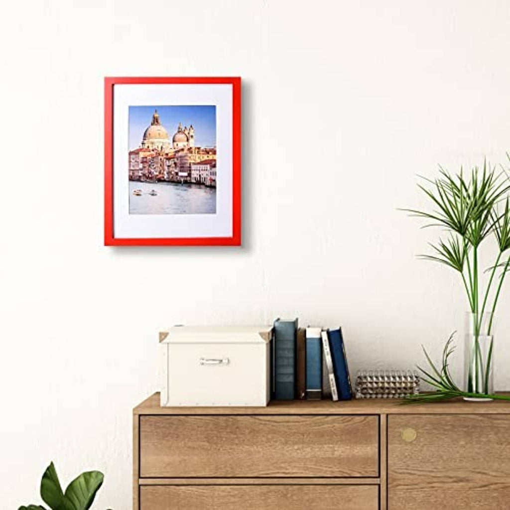 Red solid wood 11x14 picture frame with inner photo mat displayed on wall