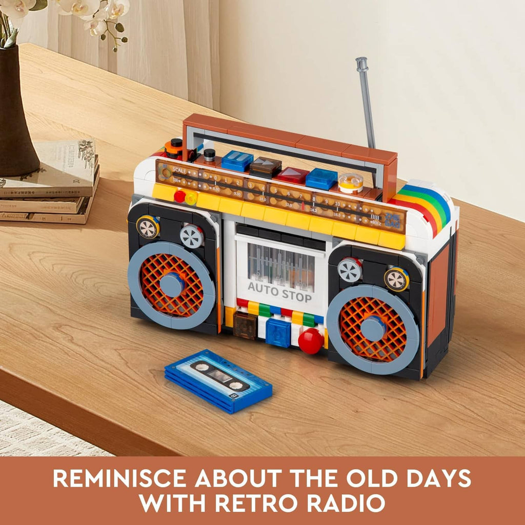 Retro radio building blocks on a tabletop with antenna, speaker grilles, and open front details