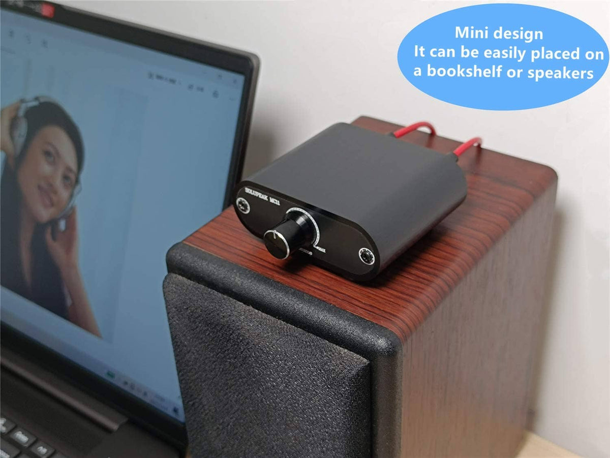 3.5mm audio volume controller box with volume knob and IN/OUT ports, dark blue metal.