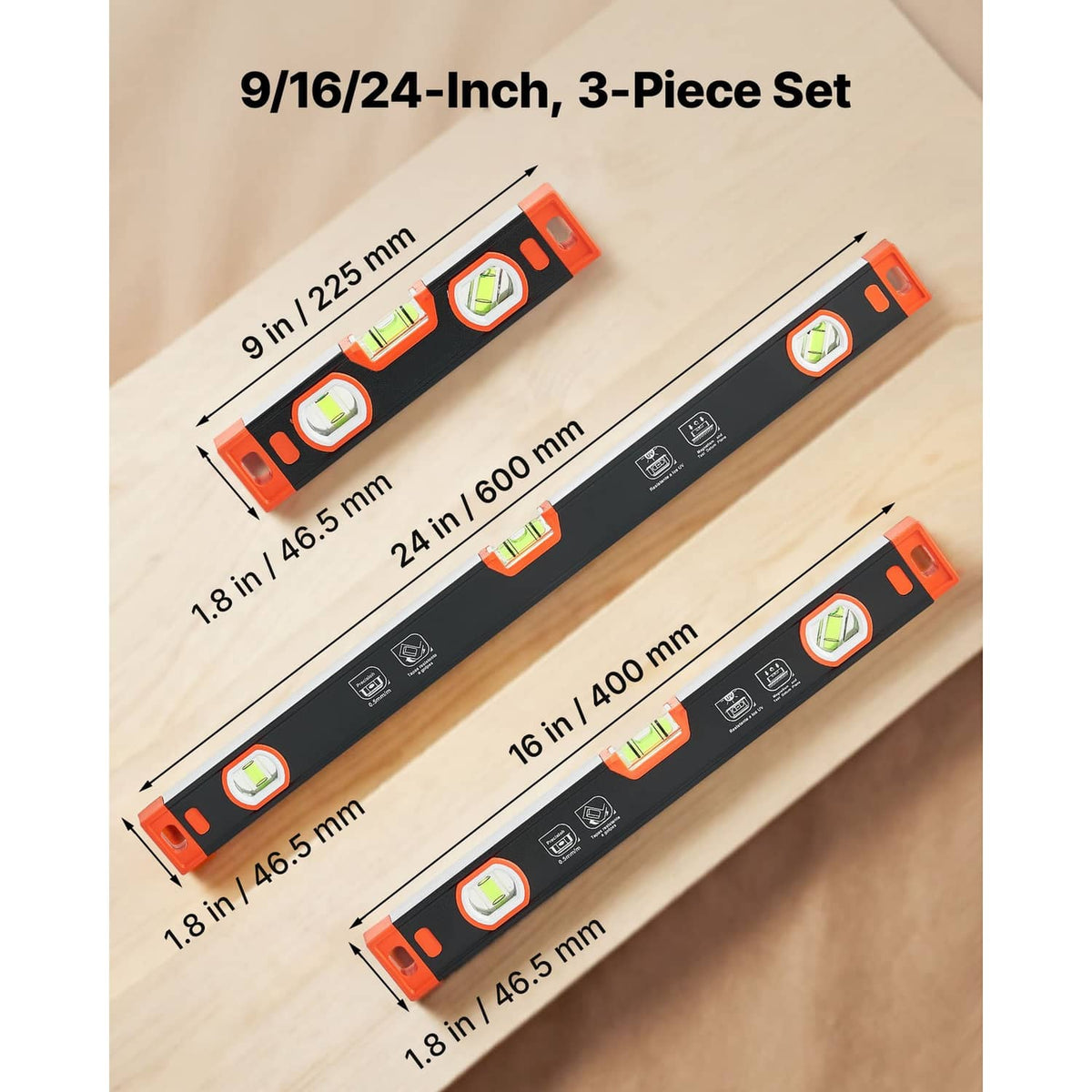 Three black and orange torpedo levels with bright orange end caps