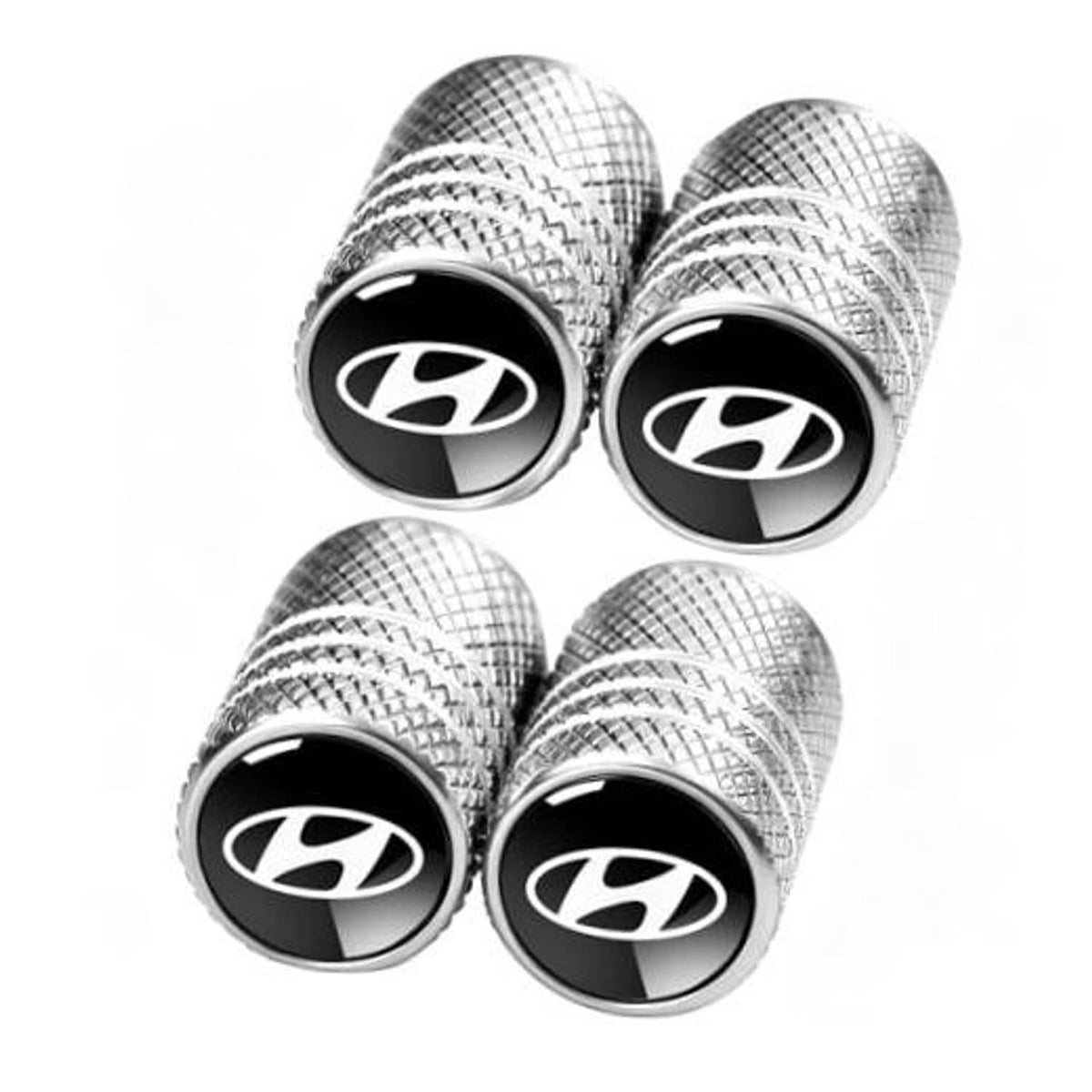 Set of four silver textured tire valve stem dust caps with black Hyundai-style logo face.