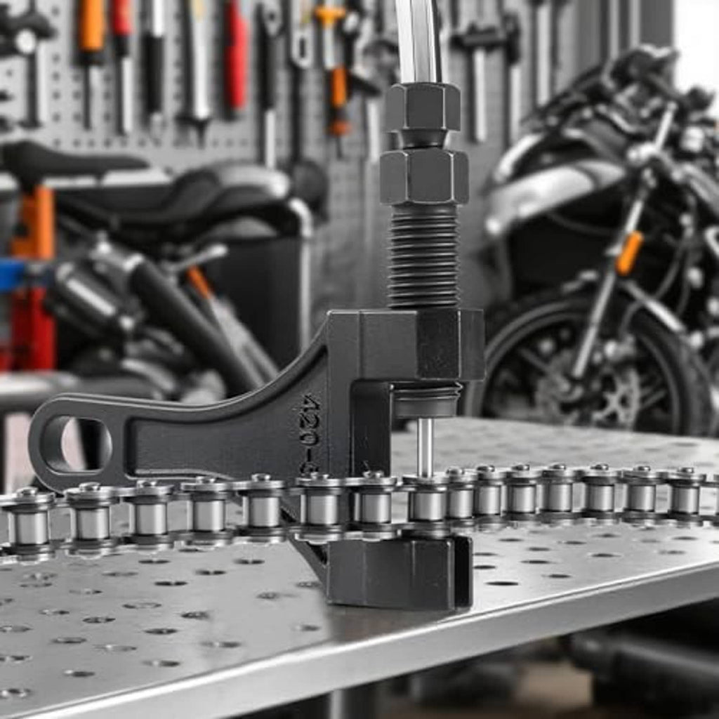 Chain breaker tool clamping a roller chain on a workbench