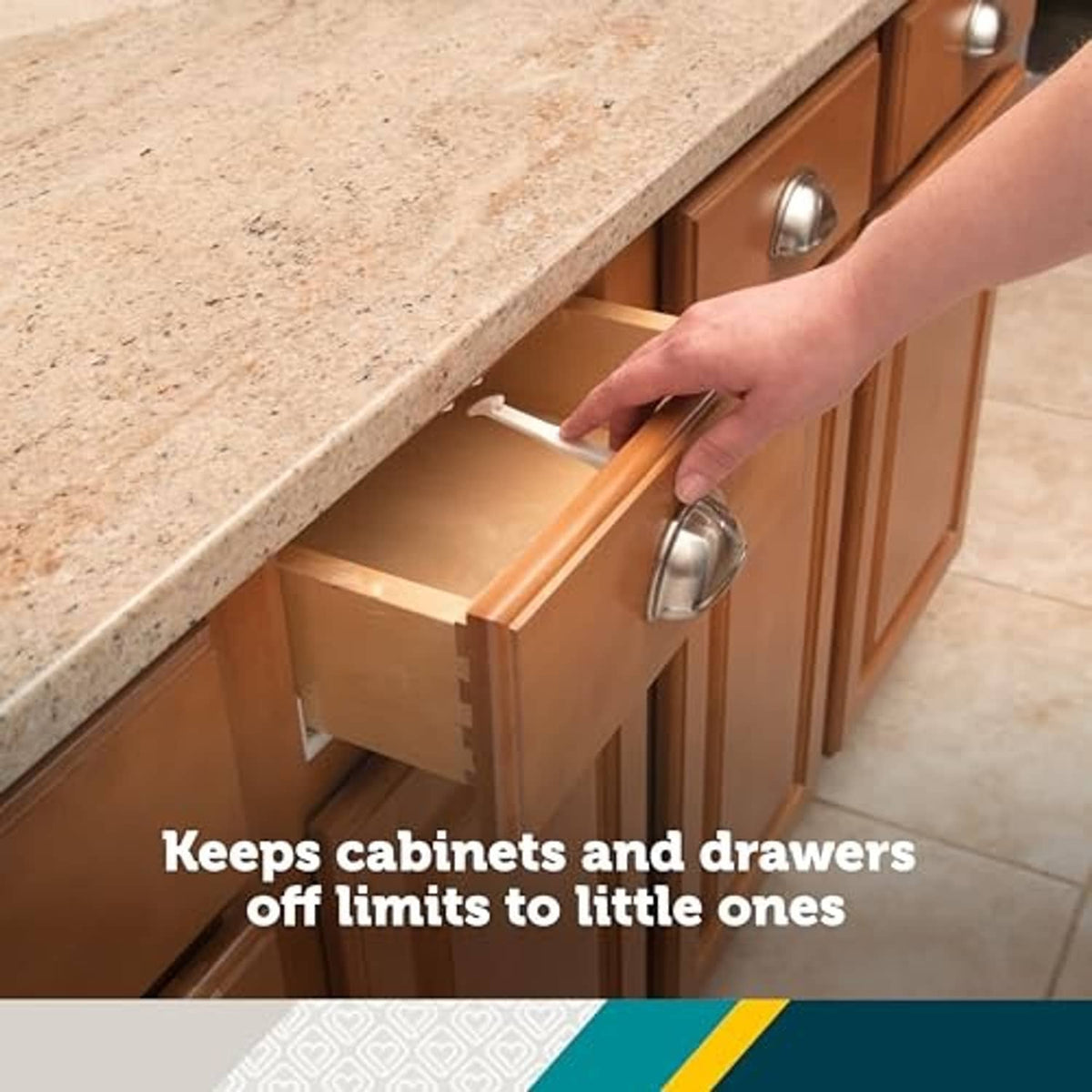 Babyproofing cabinet and drawer latch installed on a wooden cabinet, white lock