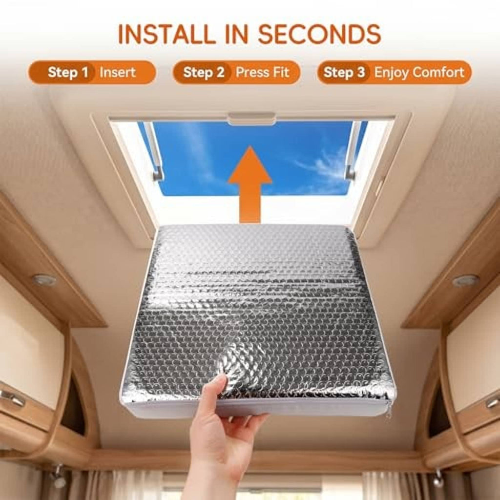 Rectangular RV skylight vent insulator pressed into place, reflective bubble-foil top