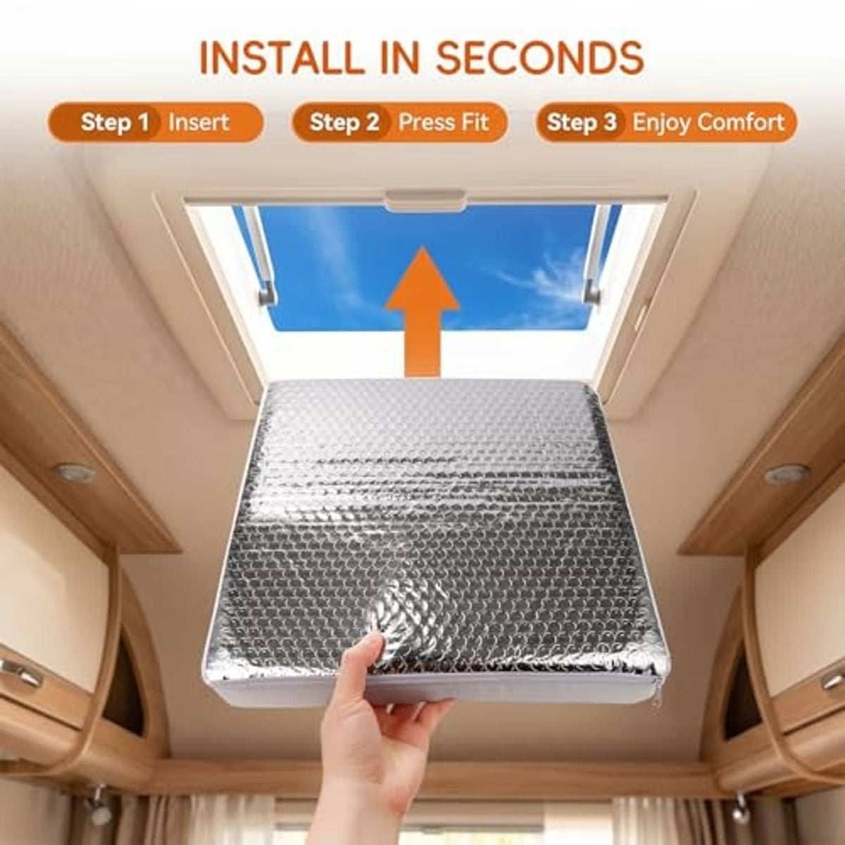 Rectangular RV skylight vent insulator pressed into place, reflective bubble-foil top