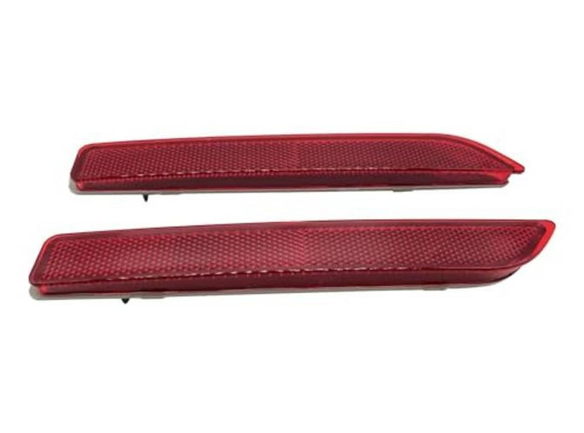Pair of red rear bumper reflector housings with textured lens face