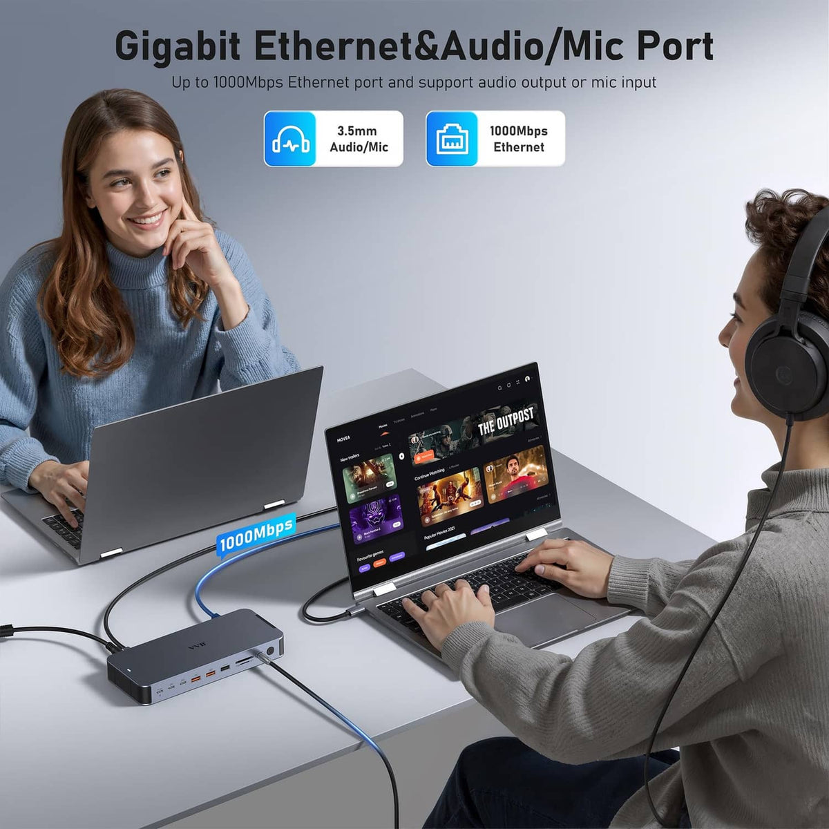 Space gray docking station with Ethernet and audio/mic ports for laptop use