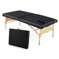 Portable folding massage table with black padded surface and carrying case
