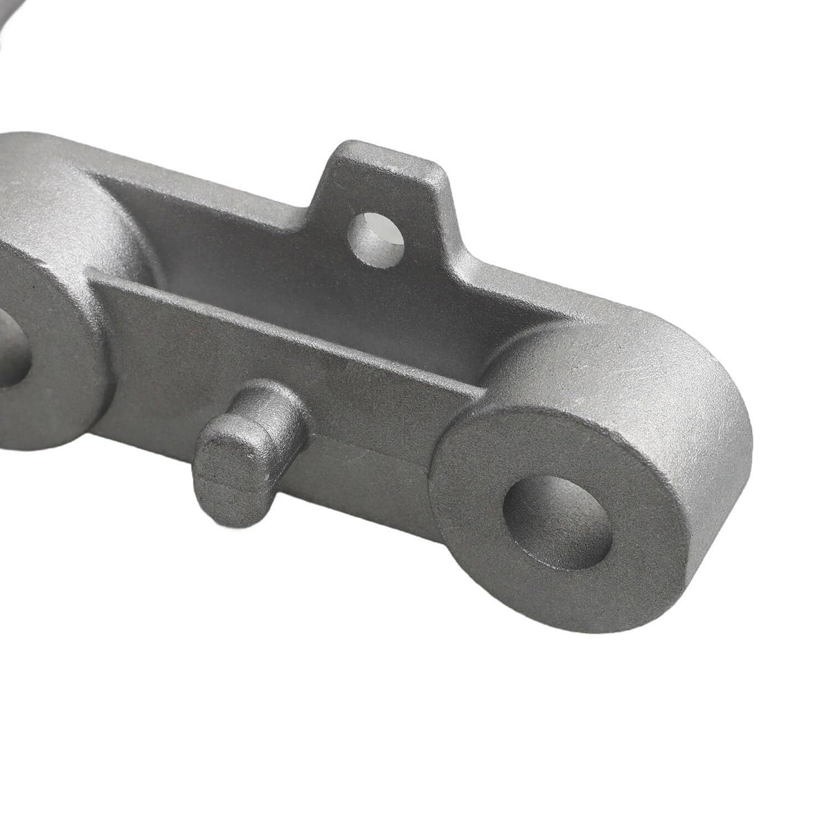 Close-up of silver exhaust bracket base with bolt post and circular mounting hole