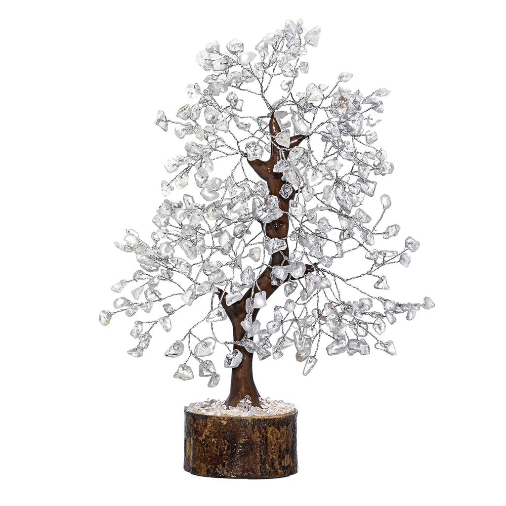 Clear quartz crystal tree decoration with silver branches on a round wooden base