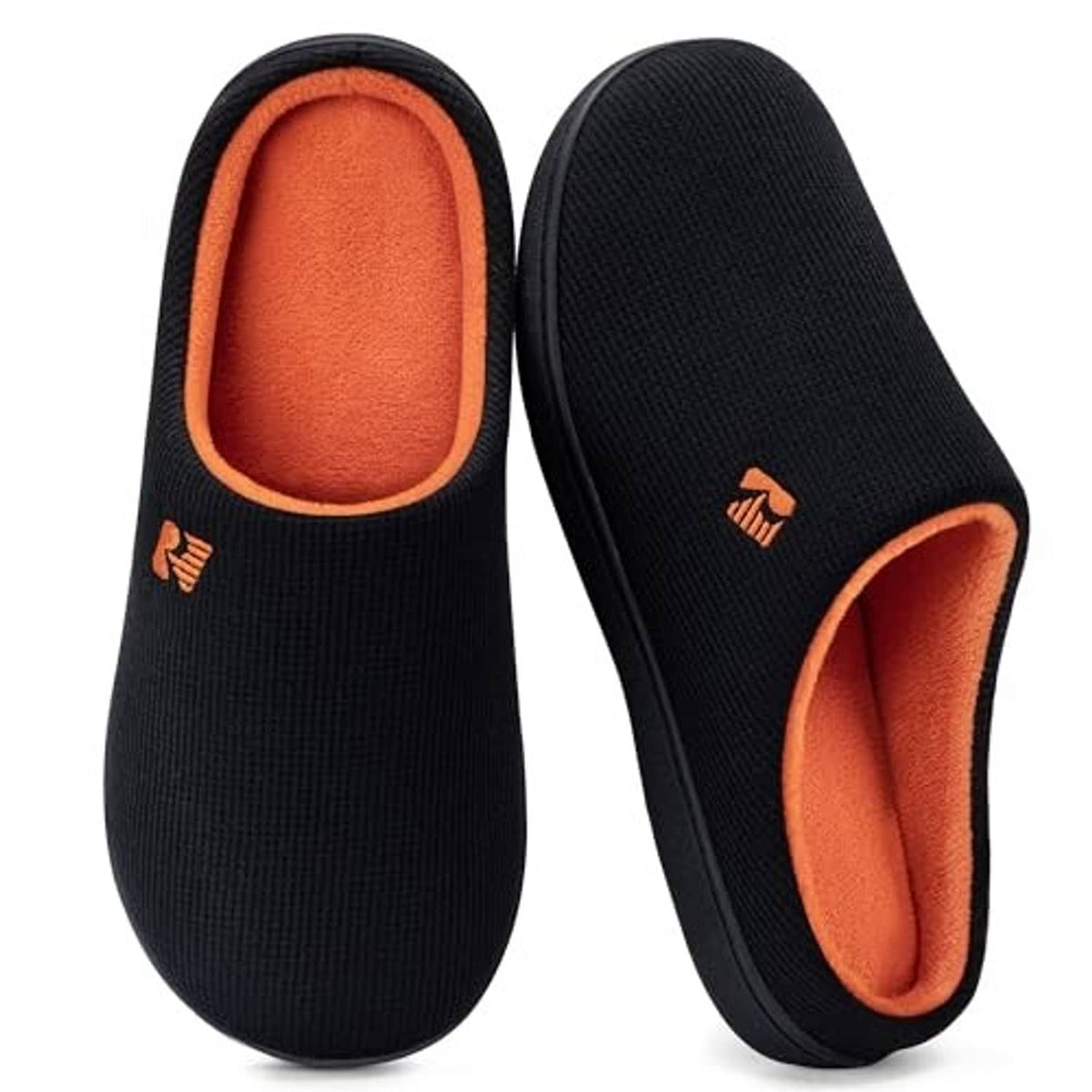 Two-tone black slip-on slippers with orange interior and small logo on side