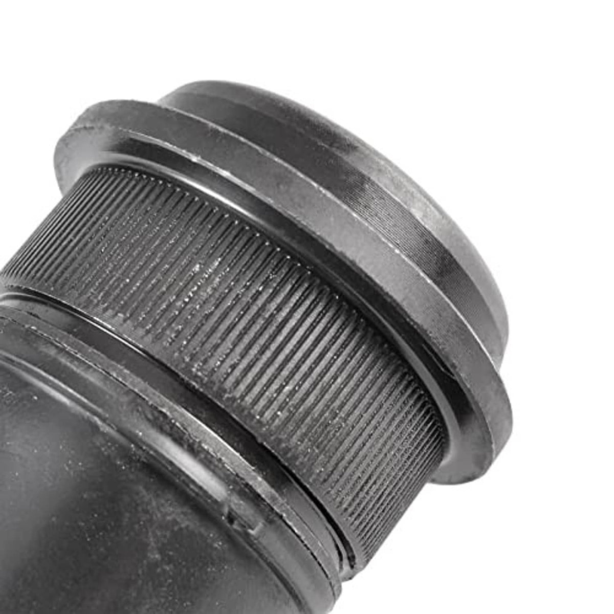 Close-up of front upper ball joint textured rubber boot and metal retaining ring